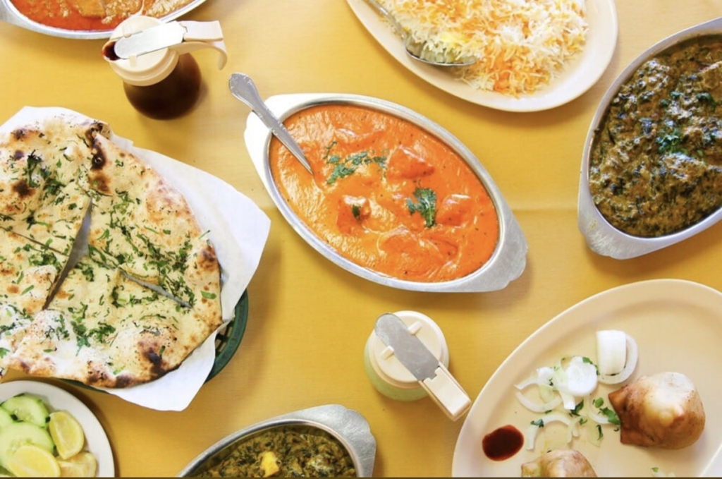 Table Set with Tikka Masala, Garlic, Naan, and Palak Paneer