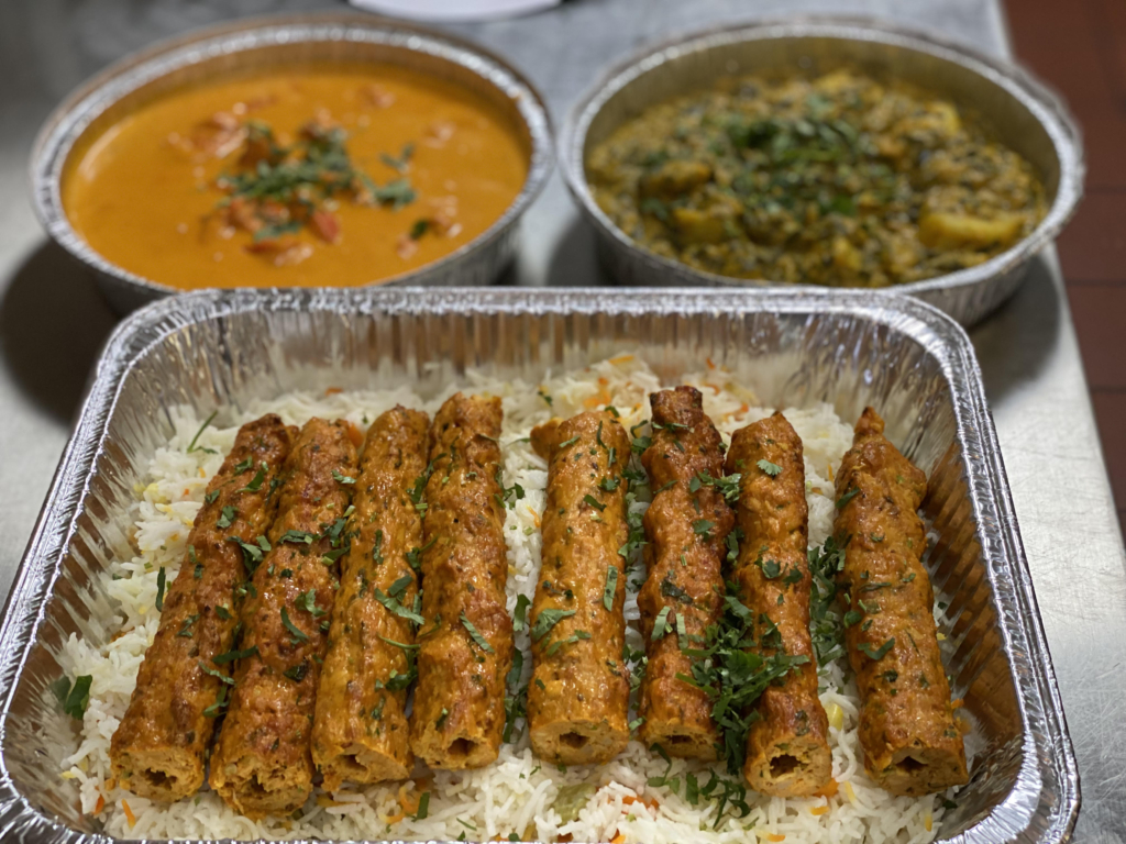 catering pic of tandoori meats and curries